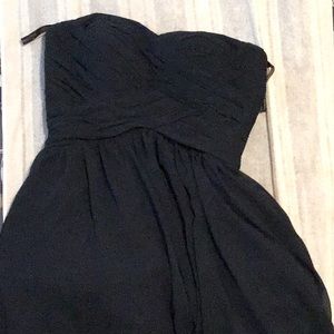 A mid-length navy blue prom dress